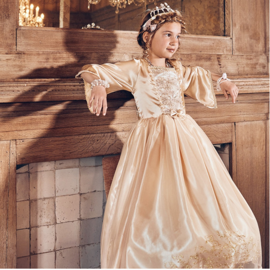 Child's full length gold pricess dress with embroidered bodice and flowing skirt.